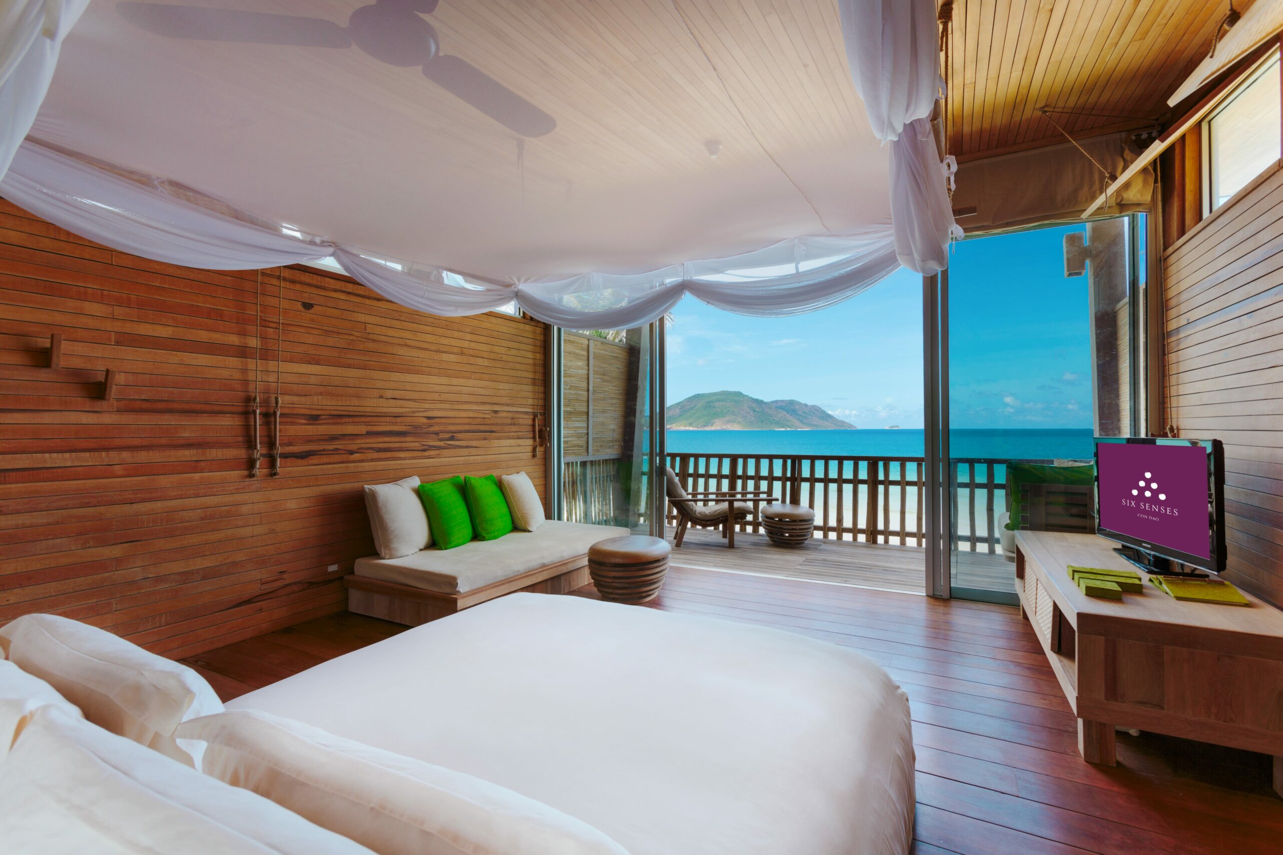 Sustainable teakwood villa at Six Senses Con Dao fronting a private white sand beach